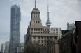 The Canada Life building (center) stands in front of the CN Tower (right), in the financial district of Toronto, on July 7, 2016.