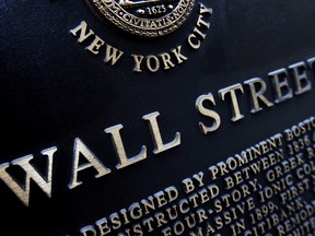 This Jan. 4, 2010, file photo shows an historic marker on Wall Street in New York.