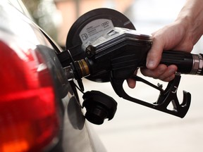The federal plan, unveiled today, combines a consumer tax on gasoline with a cap-and-trade system for major industry.