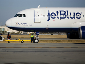 Ground operations crews ready a JetBlue Airways Corp. Airbus