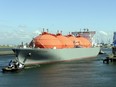 The LNG carrier, a tank ship designed for transporting liquefied natural gas, "Arctic Voyager" is towed in the port of Rotterdam.