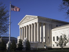 In this April 4, 2017, file the Supreme Court Building is seen in Washington. When the Supreme Court suspended a prominent Massachusetts lawyer and threatened him with disbarment, it started a Boston legal drama that took two weeks to resolve.