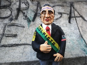 A doll portraying President Michel Temer is displayed at a protest against the government's proposed pension reforms and other austerity measures on May 1, 2017 in Rio de Janeiro, Brazil.