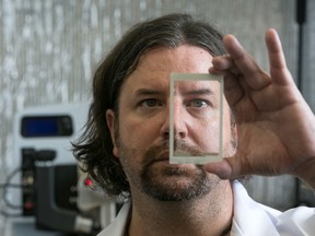 Professor Dr. Alan Dalton, University of Sussex, Brighton, UK,  with expertise in Nanotechnology, Physical Chemistry and Polymer Chemistry showing a touchscreen containing graphene