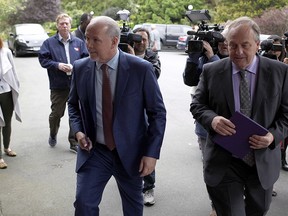 B.C. NDP leader John Horgan and B.C. Green party leader Andrew Weaver arrive at Government House to drop of a signed document by 44 MLAs showing theres an agreement between the two parties in Victoria, B.C., on Wednesday, May 31, 2017.