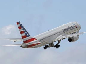 FILE - In this Friday, June 3, 2016, file photo, an American Airlines passenger jet takes off from Miami International Airport in Miami. Qatar Airways is attempting to buy a 10 percent stake in American Airlines, triggering U.S. antitrust oversight over deals of such size. American said in a regulatory filing Thursday, June 22, 2017, that the bid was unsolicited, but that there have been conversations between the CEOs of both airlines. (AP Photo/Alan Diaz, File)