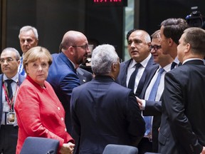 German Chancellor Angela Merkel, left, attends a round table meeting with, from left, Belgian Prime Minister Charles Michel, Portuguese Prime Minister Antonio Costa, Bulgarian Prime Minister Bokyo Borisov, Finnish Prime Minister Juha Sipila, Dutch Prime Minister Mark Rutte and Estonian Prime Minister Juri Ratas during an EU Summit in Brussels on Friday, June 23, 2017. European Union leaders met in Brussels on the final day of their two-day summit to focus on ways to stop migrants crossing the Mediterranean and how to uphold free trade while preventing dumping on Europe's markets. (AP Photo/Geert Vanden Wijngaert)