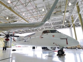 A Bombardier Q400 jet sits in a hangar at the Bombardier facility in Toronto on July 25, 2012. SpiceJet could buy up to 50 additional Q400 planes from Bombardier under a letter of intent signed at the Paris Air Show. THE CANADIAN PRESS/Aaron Vincent