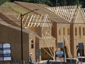 In this Tuesday, May 16, 2017, photo, work continues on new town homes under construction, in Woodstock, Ga. On Thursday, June 15, 2017, the National Association of Home Builders/Wells Fargo June index of builder sentiment is released. (AP Photo/John Bazemore)