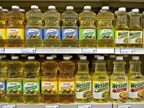 Corn, canola and vegetable oil sits on display in a supermarket in Princeton, Illinois, on June 4, 2013.