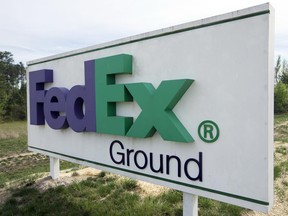 This Tuesday, April 18, 2017, photo shows a FedEx Ground sign at a warehouse in Ashland, Va. FedEx Corp. reports earnings, Tuesday, June 20, 2017. (AP Photo/Steve Helber)