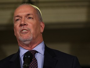 B.C. NDP leader John Horgan speaks to media about working with B.C. Green party leader Andrew Weaver after they signed an agreement on creating a stable minority government during a press conference in the Hall of Honour at Legislature in Victoria, B.C., on Tuesday, May 30, 2017.