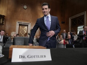 FILE - In this Wednesday, April 5, 2017, file photo, Dr. Scott Gottlieb, President Donald Trump's nominee to head the Food and Drug Administration, appears at his confirmation hearing before the Senate Committee on Health, Education, Labor, and Pensions, on Capitol Hill in Washington. The Food and Drug Administration is making two moves to rapidly increase the number of generic prescription drugs on sale in an effort to make medicines affordable and prevent future price gouging. New commissioner Gottlieb says the FDA will now give priority reviews to potential generic drugs until at least three are on the market. That's the level at which prices tend to drop sharply, up to 85 percent off the brand-name price. (AP Photo/J. Scott Applewhite, File)