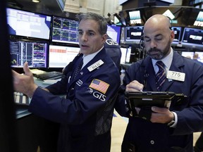 Specialist Anthony Rinaldi, left, and trader Fred Demarco work on the floor of the New York Stock Exchange, Wednesday, June 21, 2017. Stocks are opening slightly higher on Wall Street, led by gains in health care and technology companies. (AP Photo/Richard Drew)