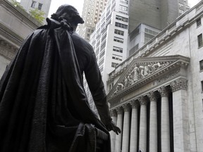 FILE - In this Oct. 2, 2014, file photo, the statue of George Washington on the steps of Federal Hall faces the facade of the New York Stock Exchange. U.S. stock indexes dipped modestly in early trading Friday, June 23, 2017, and the Standard & Poor's 500 index was on pace to end the week almost exactly where it started. Crude oil, whose tumble earlier in the week was the market's dominant story, held relatively steady. (AP Photo/Richard Drew, File)