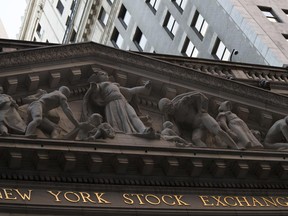 FILE - This Tuesday, Oct. 25, 2016, file photo shows the New York Stock Exchange at sunset, in lower Manhattan. Stocks are easing mostly lower in morning trading on Wall Street, Tuesday, June 20, 2017, a day after big gains from tech companies pushed indexes to their latest record highs. Technology stocks were slightly lower early Tuesday. Energy companies were also lower as the price of crude oil fell. (AP Photo/Mary Altaffer, File)
