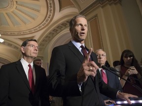 FILE - In this May 16, 2017 file photo, Sen. John Thune, R-S.D. speaks on Capitol Hill in Washington. Republicans are touting lower premiums under their health care legislation, but that reflects insurance that would cover a smaller share of the cost of medical bills. (AP Photo/J. Scott Applewhite, File)