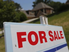 In this Tuesday, May 16, 2017, photo, a sign advertises an existing home for sale in Roswell, Ga. On Wednesday, June 21, 2017, the National Association of Realtors reports on sales of existing homes in May. (AP Photo/John Bazemore)