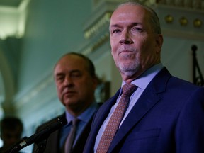 B.C. Green party leader Andrew Weaver and B.C. NDP leader John Horgan speak to media after announcing they'll be working together to help form a minority government during a press conference at Legislature in Victoria, B.C., on Monday, May 29.
