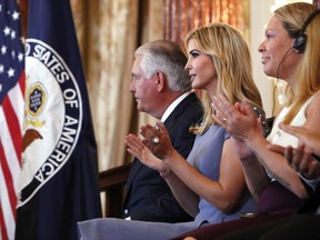 From left, Secretary of State Rex Tillerson, left, Ivanka Trump, and Alika Kinan, of Argentina, attend a 2017 Trafficking in Persons Report ceremony, Tuesday, June 27, 2017, at the State Department in Washington. Kinan was one of eight individuals honored for their work to stop human trafficking. (AP Photo/Jacquelyn Martin)