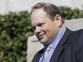 FILE - In this Sept. 9, 2015, file photo, former Multi-State Lottery Association security director Eddie Tipton leaves the Polk County Courthouse in Des Moines, Iowa, after his sentencing in a jackpot-fixing scandal. The Iowa Supreme Court overturned the conviction of Tipton implicated in a nationwide fixing scandal Friday, June 23, 2017, saying his trial in a rigged $16.5 million Iowa jackpot was tainted by a dawdling investigation. (AP Photo/Charlie Neibergall File)