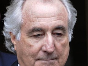 FILE - In this March 10, 2009 file photo, Bernard Madoff exits Manhattan federal court in New York. According to a bankruptcy court filing, the estates of Ponzi king Bernard Madoff's two sons will get nearly $4 million after about $18 million in assets are taken away as part of a legal settlement. The settlement terms were contained in papers filed by a court-appointed trustee Monday, June 26, 2017, in Manhattan U.S. Bankruptcy Court. (AP Photo/Louis Lanzano, File)