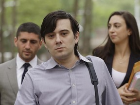 FILE - In this Monday, June 19, 2017, file photo, former Turing Pharmaceuticals CEO Martin Shkreli arrives at Brooklyn federal court with members of his legal team, in New York, for a pretrial conference in his securities fraud trial. Shkreli's trial begins Monday, June 26. (AP Photo/Mark Lennihan, File)