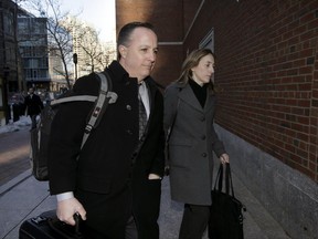 FILE- In this March 16, 2017, file photo, Barry Cadden, centre, arrives at the federal courthouse in Boston, before scheduled closing arguments in his trial.