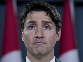 Prime Minister Justin Trudeau pauses as he speaks at a media availability at the National Press Theatre in Ottawa on Tuesday, June 27, 2017. THE CANADIAN PRESS/Justin Tang