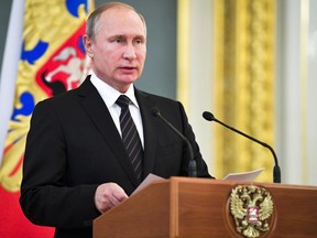 Russian President Vladimir Putin addresses graduates of military and police academies in Moscow,s Kremlin, Russia, Wednesday, June 28, 2017. Putin has pledged to continue efforts to beef up the Russian military and law-enforcement agencies. (Alexei Druzhinin/Sputnik, Kremlin Pool Photo via AP)