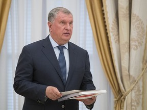 CEO of state-controlled Russian oil company Rosneft, Igor Sechin, holds papers prior a meeting with Saudi Deputy Crown Prince and Defense Minister Mohammed bin Salman in Moscow's Kremlin, Russia, Tuesday, May 30, 2017.