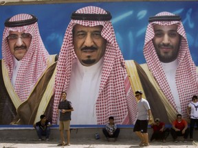 A billboard showing in the center, King Salman, with his 31-year-old son Mohammed bin Salman to the right, and Prince Mohammed bin Nayef to the left in Taif, Saudi Arabia. Salman appointed his son, who was until now the deputy crown prince and country's defense minister, as his successor and first in line to the throne. Salman stripped Mohammed bin Nayef of the title of crown prince and ousted him from his powerful position of interior minister.