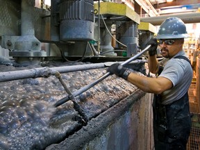 A technician works at Stillwater Mining's Columbus processing plant. The company is a leading producer of palladium and platinum.