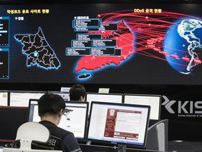 FILE - In this Monday, May 15, 2017, file photo, employees watch electronic boards to monitor possible ransomware cyberattacks at the Korea Internet and Security Agency in Seoul, South Korea. Unable to rely on good human behavior, computer security experts are developing software techniques to fight ransomware. But getting these protections in the hands of users is challenging. (Yun Dong-jin/Yonhap via AP, File)