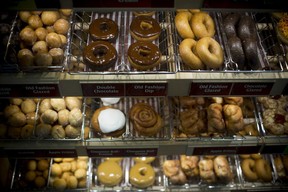 Doughnuts sit on display at a Tim Hortons restaurant in Oakville.