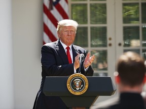 President Donald Trump applauds after speaking about the U.S. role in the Paris climate change accord, Thursday, June 1, 2017, in the Rose Garden of the White House in Washington. (AP Photo/Pablo Martinez Monsivais) ORG XMIT: DCPM216