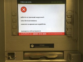 A screen of an idle virus affected cash machine in a state-run OshchadBank says "Sorry for inconvenience/Under repair" in Kiev, Ukraine, Wednesday, June 28, 2017. The cyberattack ransomware that has paralyzed computers across the world hit Ukraine hardest Tuesday, with victims including top-level government offices, energy companies, banks, cash machines, gas stations, and supermarkets.  (AP Photo/Efrem Lukatsky)