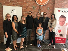 Victory Square Technologies founder and CEO Shafin Diamond Tejani (centre-left) with Natasha Golinsky and her daughter Kalenna (centre-right). Also pictured, Howard Blank (second from right), Variety BC CEO Kristy Gill (right), and Variety BC staff (left).