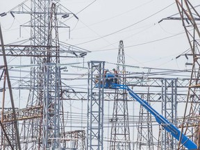 Crews do some work on a maze of hydro lines.