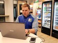 Tony Danna, vice-president of international development at Three Square Market, works on his laptop in a company break room.