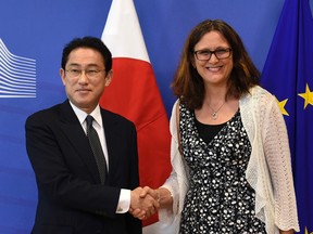 EU Commissioner of Trade Cecilia Malmstrom and Japan's Foreign minister Fumio Kishida.