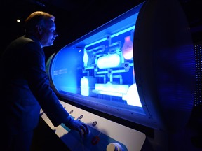 Bank of Canada Governor Stephen Poloz checks out the new BoC museum in Ottawa.