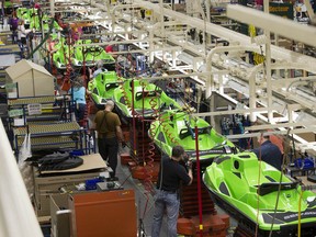 Employees work on an assembly line in Valcourt, Quebec.