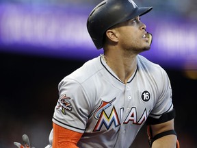 Miami Marlins' Giancarlo Stanton watches his two-run home run off San Francisco Giants' Matt Moore during the first inning of a baseball game Friday, July 7, 2017, in San Francisco. (AP Photo/Ben Margot)