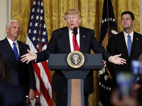 President Donald Trump, accompanied by Vice President Mike Pence, and House Speaker Paul Ryan of Wis., speaks in the East Room of the White House, Wednesday, July 26, 2017, in Washington. Trump is announcing the first U.S. assembly plant for electronics giant Foxconn in a project that's expected to result in billions of dollars in investment in the state and create thousands of jobs. (AP Photo/Alex Brandon)