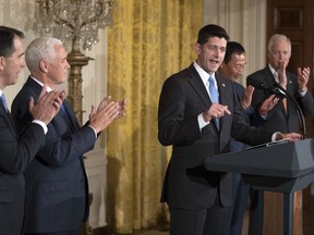 House Speaker Paul Ryan of Wis., joined by Wisconsin Gov. Scott Walker, left, Vice President Mike Pence, Terry Gou, president and chief executive officer of Foxconn, and Sen. Ron Johnson, R-Wis., speaks in the East Room of the White House in Washington, Wednesday, July 26, 2017. (AP Photo/Carolyn Kaster)