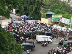 Union workers gather while on strike outside the main oil installation facility in Colombo, Sri Lanka, Wednesday, July 26, 2017. Sri Lanka's government has deployed army troops to restore fuel distribution crippled during a strike launched by trade unions who want to stop leases of oil tanks to India and China. (AP Photo/Sajeewa Chinthaka)