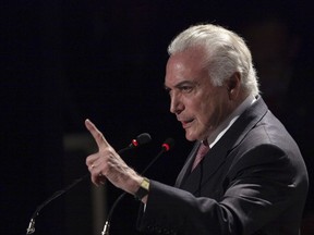 Brazil's President Michel Temer speaks during a ceremony in Brasilia, Brazil, Tuesday, July 11, 2017. A key Brazilian lawmaker is arguing to his colleagues that Temer should be suspended from office and put on trial in the country's highest court on a corruption charge. The committee will vote on the recommendation within days, but the final decision on Temer's future will be made by the full house. (AP Photo/Eraldo Peres)