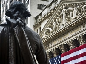 FILE - In this Wednesday, July 8, 2015, file photo, a statue of George Washington stands at Federal Hall near the flag-covered pillars of the New York Stock Exchange, in New York. Global shares are mostly higher in Europe, Wednesday, July 5, 2017, after Asia reversed early losses spurred by concern over North Korea's launch of a long-range missile on Tuesday. Trading was subdued after the U.S. Independence Day holiday and ahead of the summit of the Group of 20 industrial nations later in the week. (AP Photo/Bebeto Matthews, File)