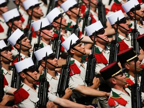 French soldiers march down the Champs Elysees during the Bastille Day parade in Paris, Friday, July 14, 2017.